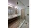 Modern bathroom with glass shower, double sinks, and contemporary fixtures at 32325 State Road 44, Eustis, FL 32736