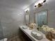 Bright bathroom featuring a marble countertop, vessel sinks, and modern gold accents at 32325 State Road 44, Eustis, FL 32736