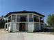 Stunning two-story home features a unique architectural design, balconies and a welcoming entrance at 32325 State Road 44, Eustis, FL 32736