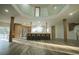 Spacious open-concept kitchen featuring a large island with seating, sleek countertops, and natural lighting at 32325 State Road 44, Eustis, FL 32736