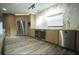 Modern kitchen features stainless steel appliances, custom cabinetry, a wine fridge, and stylish marble backsplash at 32325 State Road 44, Eustis, FL 32736