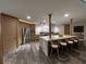 Well-lit kitchen features an island with seating, modern appliances, stylish cabinetry, and luxury countertops at 32325 State Road 44, Eustis, FL 32736