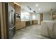 Gourmet kitchen featuring stainless steel appliances, custom cabinets, marble countertops, and modern lighting at 32325 State Road 44, Eustis, FL 32736