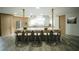 Charming kitchen with marble countertops, a large island with seating, custom cabinets, and modern appliances at 32325 State Road 44, Eustis, FL 32736