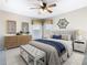 This is a primary bedroom with a beautiful ceiling fan and neutral decor and color palette at 330 Rosso Dr, Davenport, FL 33837