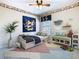 A bedroom with Mickey Mouse decor, colorful accents, and whimsical furniture at 330 Rosso Dr, Davenport, FL 33837