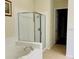 Bathroom featuring a glass-enclosed shower and a soaking tub, creating a spa-like experience at 3368 Robert Trent Jones Dr # 40808, Orlando, FL 32835