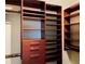 Walk-in closet with custom wood shelving, drawers, and ample storage space for organizing belongings at 3368 Robert Trent Jones Dr # 40808, Orlando, FL 32835