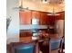 Kitchen featuring granite counters, stainless steel appliances, and wood cabinetry at 3368 Robert Trent Jones Dr # 40808, Orlando, FL 32835