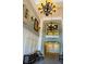 Lobby showcasing high ceilings, decorative lighting, seating area, and elevator access at 3368 Robert Trent Jones Dr # 40808, Orlando, FL 32835