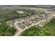 Expansive aerial view of a community with mature trees, ponds, and well-maintained homes at 350 Black Springs Ln, Winter Garden, FL 34787