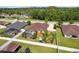 Aerial view of a fenced backyard, showcasing a pool, playset, and lush greenery at 350 Black Springs Ln, Winter Garden, FL 34787