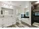 Bathroom featuring a double vanity, soaking tub, and tiled shower with glass door at 350 Black Springs Ln, Winter Garden, FL 34787