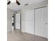 Bedroom featuring a ceiling fan, spacious closet, and light gray walls with wood-look floors at 350 Black Springs Ln, Winter Garden, FL 34787