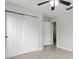 Bedroom featuring a ceiling fan, light gray walls, a spacious closet, and wood-look floors at 350 Black Springs Ln, Winter Garden, FL 34787