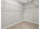 Spacious walk-in closet with ample shelving and neutral paint, offers plenty of storage space at 350 Black Springs Ln, Winter Garden, FL 34787