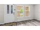 Bright foyer features a decorative front door, wood-look flooring, and natural light at 350 Black Springs Ln, Winter Garden, FL 34787