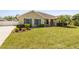 Beautiful home featuring a well-kept lawn, landscaped garden beds, and blue window shutters at 350 Black Springs Ln, Winter Garden, FL 34787