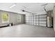 Clean and spacious two-car garage with ample storage space, and bright lighting at 350 Black Springs Ln, Winter Garden, FL 34787