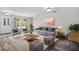 Stylishly furnished living room with modern decor, wood-look floors, and plenty of seating at 350 Black Springs Ln, Winter Garden, FL 34787