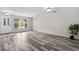 Spacious living room with wood-look flooring, lots of natural light, and neutral paint at 350 Black Springs Ln, Winter Garden, FL 34787