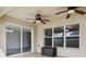 Covered patio featuring dual ceiling fans, natural light, and tiled flooring, is perfect for entertaining at 350 Black Springs Ln, Winter Garden, FL 34787