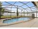 A screened-in pool with a safety fence offers a secure and relaxing outdoor space at 350 Black Springs Ln, Winter Garden, FL 34787