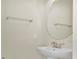 Powder bath with an oval mirror and chrome hardware at 3729 Pacific Ln, Davenport, FL 33897