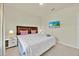 Comfortable bedroom featuring a queen-sized bed, with lamps and bedside tables at 3729 Pacific Ln, Davenport, FL 33897