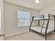 Cozy bedroom with a bunk bed and natural light at 3729 Pacific Ln, Davenport, FL 33897