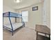 Bedroom with a blue bunk bed, window and a desk at 3729 Pacific Ln, Davenport, FL 33897