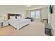 Large bedroom with a queen bed, couch, and television, perfect for relaxation at 3729 Pacific Ln, Davenport, FL 33897