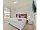Cozy bedroom featuring a queen-sized bed, TV, and side tables at 3729 Pacific Ln, Davenport, FL 33897