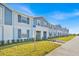 Charming townhome community with well-kept landscaping and a sidewalk at 3729 Pacific Ln, Davenport, FL 33897