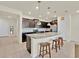 Stylish kitchen featuring a granite island with seating and stainless steel appliances at 3729 Pacific Ln, Davenport, FL 33897