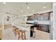 Chic kitchen with granite countertops, seating at the island, and stainless steel appliances at 3729 Pacific Ln, Davenport, FL 33897