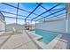 View of the backyard pool, screened-in for outdoor enjoyment at 3729 Pacific Ln, Davenport, FL 33897