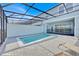Beautiful pool and patio with backyard views, under a screen enclosure at 3729 Pacific Ln, Davenport, FL 33897