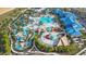 Stunning aerial view of the community pool with lazy river and water slides at 3838 Lana Ave, Davenport, FL 33897