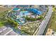 Aerial view of the community amenities including pools, water park, and putt putt golf at 3838 Lana Ave, Davenport, FL 33897