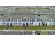 Expansive aerial view of a community of townhomes with parking and green spaces at 3838 Lana Ave, Davenport, FL 33897