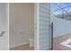 Enclosed toilet room features white fixtures and blue siding visible from exterior at 3838 Lana Ave, Davenport, FL 33897