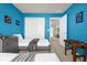 Bright blue ' bedroom with two twin beds, dresser, and carpeted flooring at 3838 Lana Ave, Davenport, FL 33897