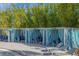 Poolside cabanas with striped curtains and comfortable lounge chairs for relaxation at 3838 Lana Ave, Davenport, FL 33897