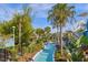 Relaxing lazy river winding through a landscaped area near a waterslide at 3838 Lana Ave, Davenport, FL 33897
