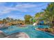 Relaxing lazy river with lush landscaping and bridges for a tranquil experience at 3838 Lana Ave, Davenport, FL 33897