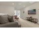 Upstairs living area with comfortable seating and a mounted television at 3838 Lana Ave, Davenport, FL 33897