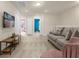 Cozy upstairs living room with comfortable seating and neutral decor at 3838 Lana Ave, Davenport, FL 33897