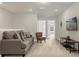 Second-floor living space with comfortable seating and modern decor at 3838 Lana Ave, Davenport, FL 33897