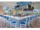 Elegant outdoor bar featuring multiple TVs and comfortable seating at 3838 Lana Ave, Davenport, FL 33897
